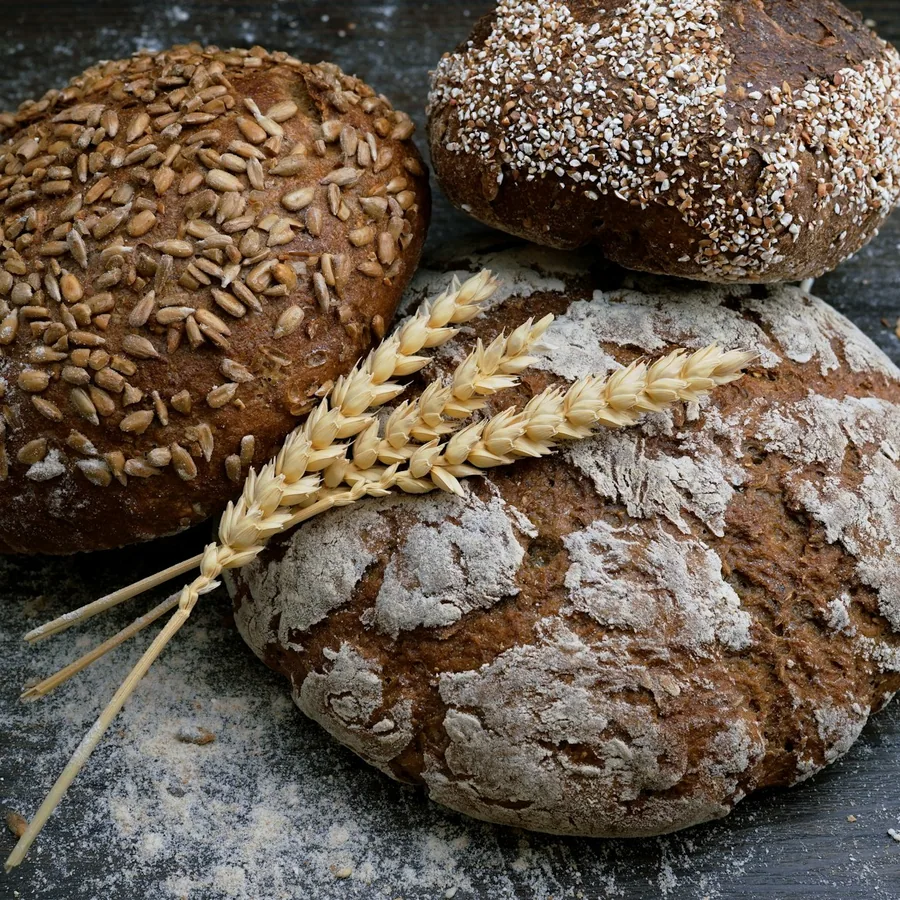 Crackled country sourdough loaves with wheat